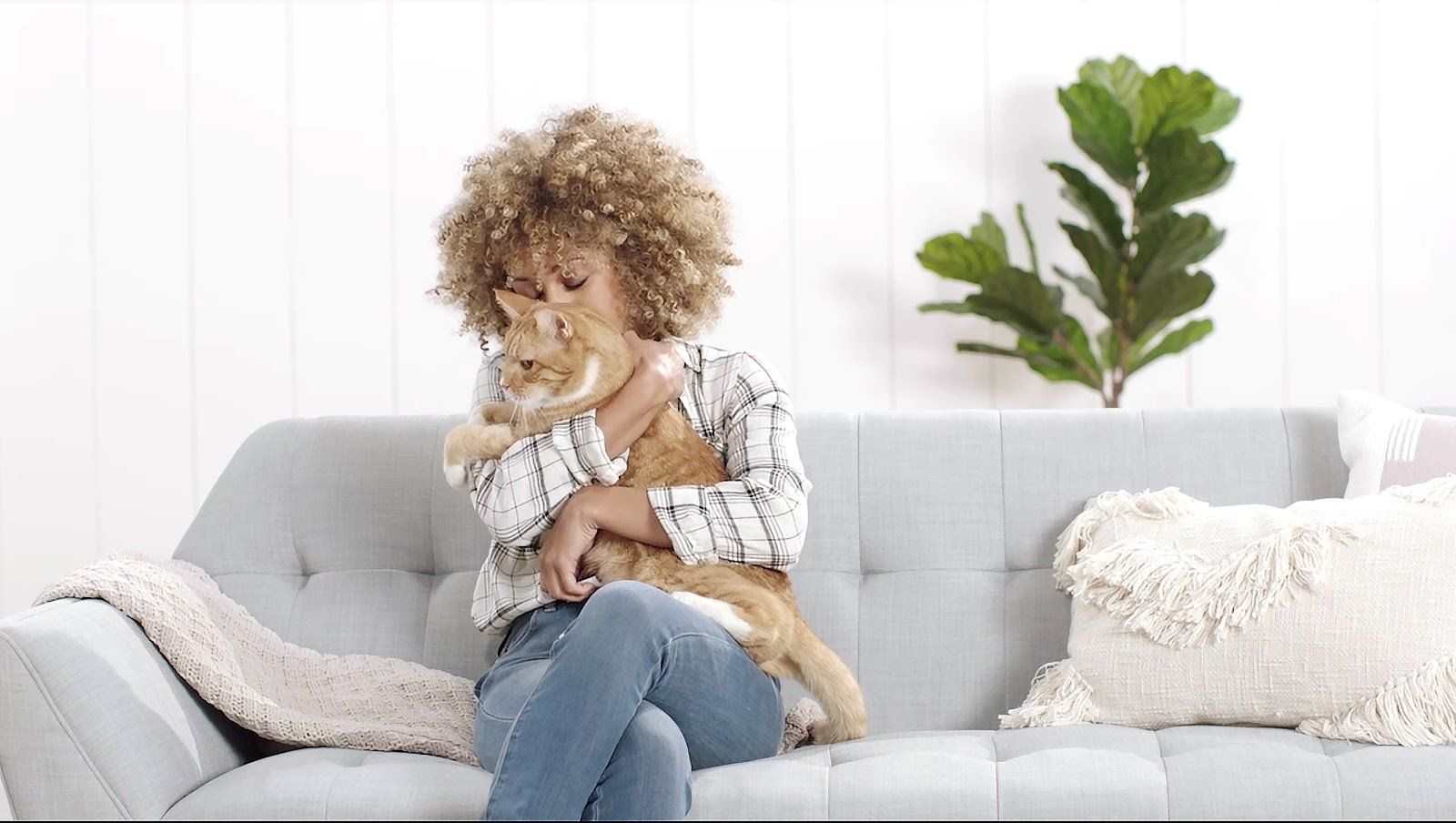 woman holding cat